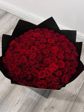 Centennial Elegance 100 red roses bouquet top view - Flowers Station Winnipeg