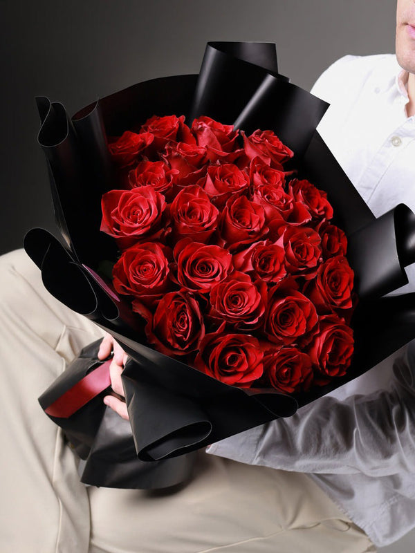 From a Gentleman bouquet with 25 red white and pink roses hand-tied - Flowers Station Winnipeg
