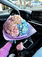 Fresh hydrangea bouquet arrangement in elegant wrapping
