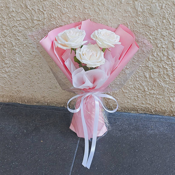 Flowers Station Winnipeg - mini rose bouquet with red pink and white roses hand-wrapped in premium paper with ribbon