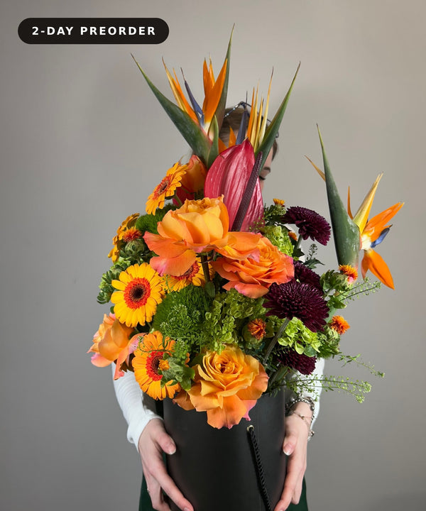 Tropical hat box arrangement with birds of paradise, orange roses and gerberas — 2-day preorder — Flowers Station Winnipeg